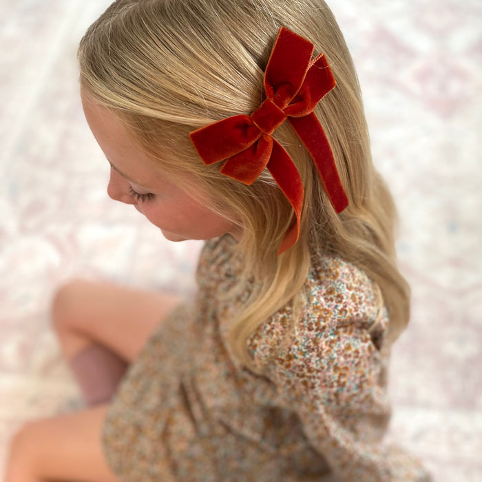 Fable Petite Velvet Bow in Saffron Velvet, perfect for everyday, Christmas and special occasions, copper velvet hair bow, orange velvet bow, velvet hair bow uk, copper bow, autumn velvet bow clip, autumn hair bows for girls, copper bow hairclip, little girls velvet hair bow clip, pumpkin spice
