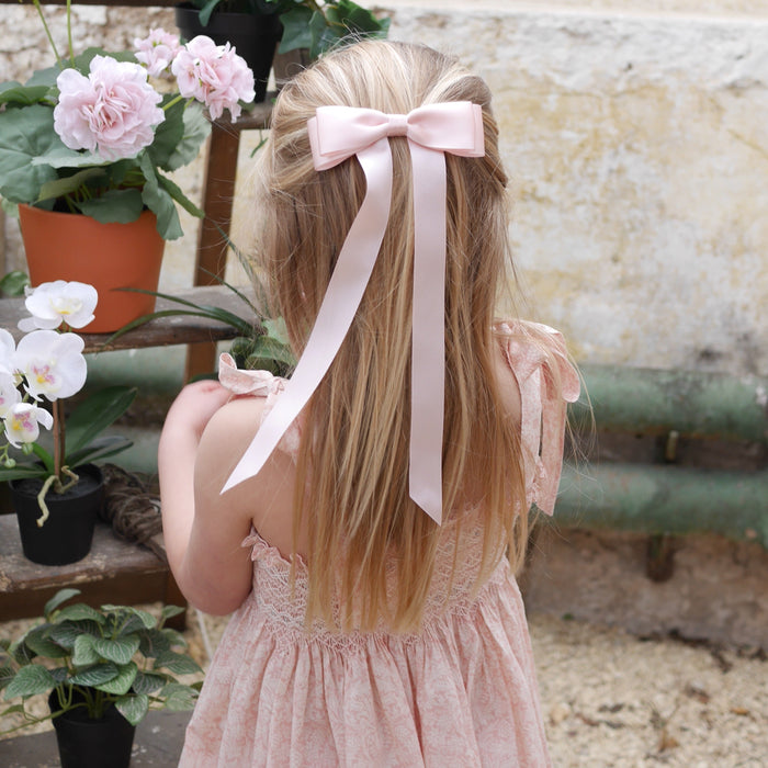 Little Love Fleur Satin Bow Barrette in Pink, Oversize satin hair bow, pale pink satin hair bow, silk satin hair bow uk, pink bow for little girll, flower girl bow satin, large silk bow in hair, pink satin bow on little girl with long hair,  pink satin bow barrette, hair bow in pink satin, little girl wearing pink bow,  pink hair accessory