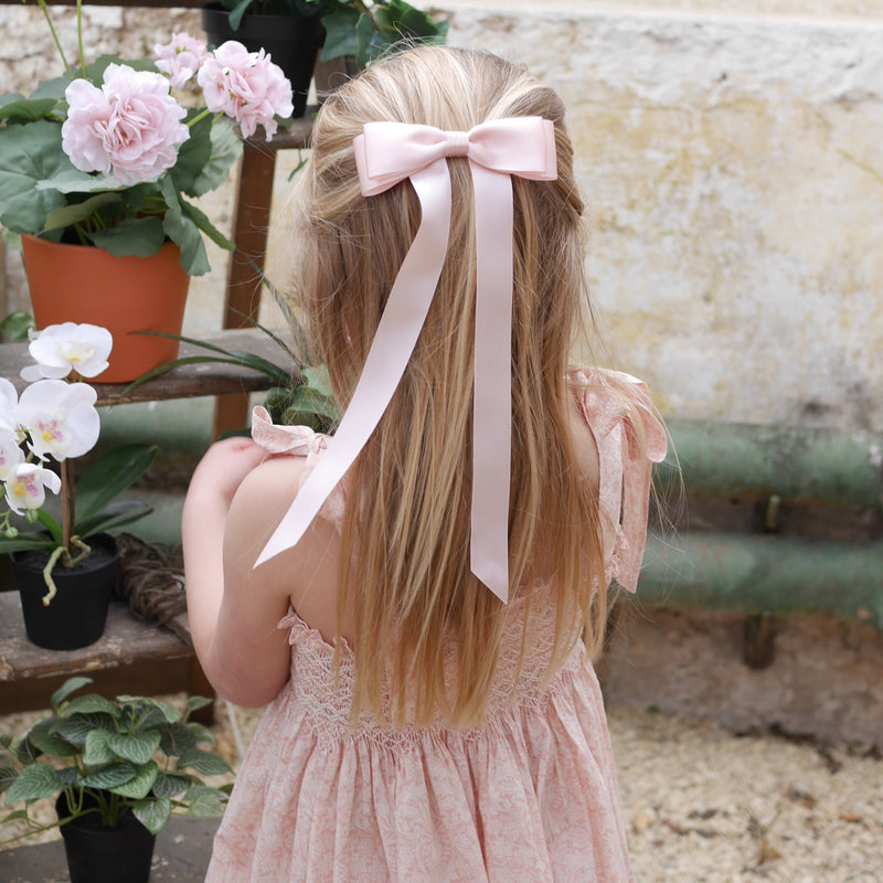 Little Love Fleur Satin Bow Barrette in Pink, Oversize satin hair bow, pale pink satin hair bow, silk satin hair bow uk, pink bow for little girll, flower girl bow satin, large silk bow in hair, pink satin bow on little girl with long hair,  pink satin bow barrette, hair bow in pink satin, little girl wearing pink bow,  pink hair accessory