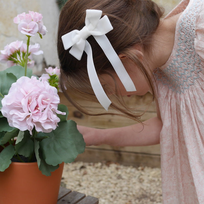 Fable Petite Velvet hair bow in pale Ivory, perfect for everyday, and special occasions, ivory velvet hair bow, ivory velvet hair bow, velvet hair bow uk, ivory flower girl bow, ivory velvet bow clip, ivory bow for flower girl, velvet bow hair clip in ivory, long velvet hair bow in ivory