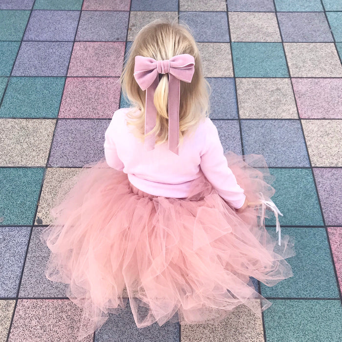 Little Love Ever After Pink Azalea Bow Barrette worn by toddler flower girl with blonde hair with pink tutu skirt