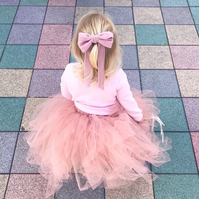 Little Love Ever After Pink Azalea Bow Barrette worn by toddler flower girl with blonde hair with pink tutu skirt