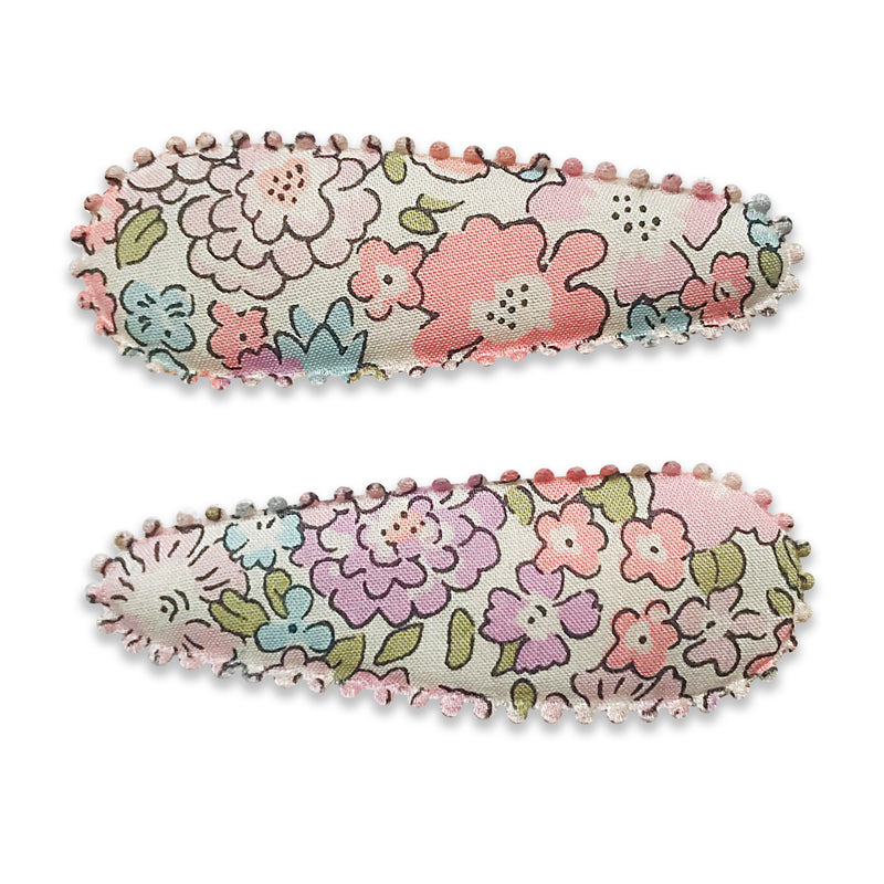 Liberty fabric covered snap clips from Josie Joans. Toddler hair clips, baby hair clips, soft fabric hair clips for baby, toddler hair slides, Liberty hair accessories, liberty print hair clips, snap hair clips, toddler snap hair clip, Josie Joans, Josie Joans UK, Josie Joans hair clips UK, Liberty Michelle Hair clips