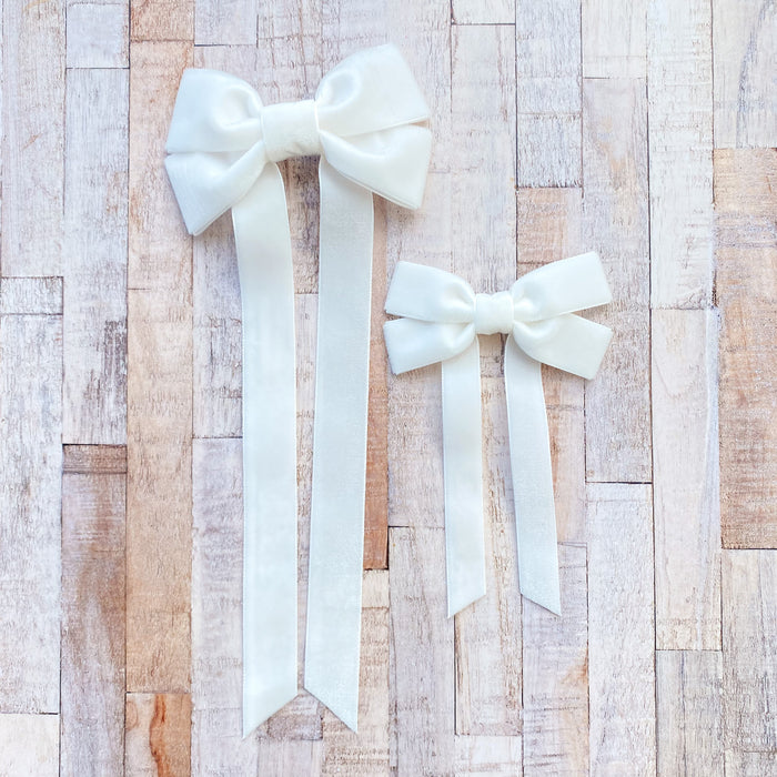 Fable Petite Velvet hair bow in pale Ivory, perfect for everyday, and special occasions, ivory velvet hair bow, ivory velvet hair bow, velvet hair bow uk, ivory flower girl bow, ivory velvet bow clip, ivory bow for flower girl, velvet bow hair clip in ivory, long velvet hair bow in ivory