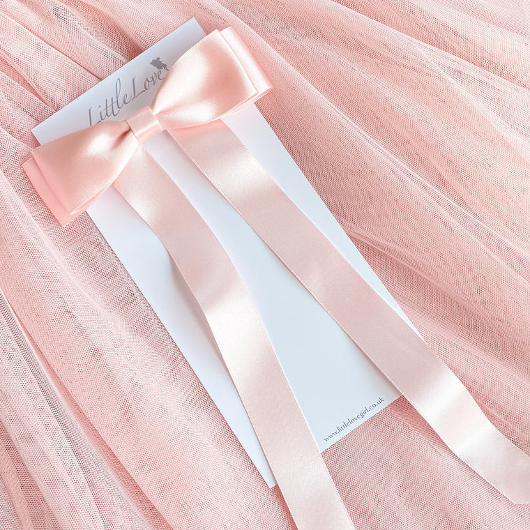 Little Love Fleur Satin Bow Barrette in Pink, Oversize satin hair bow, pale pink satin hair bow, silk satin hair bow uk, pink bow for little girll, flower girl bow satin, large silk bow in hair, pink satin bow on little girl with long hair,  pink satin bow barrette, hair bow in pink satin, little girl wearing pink bow,  pink hair accessory